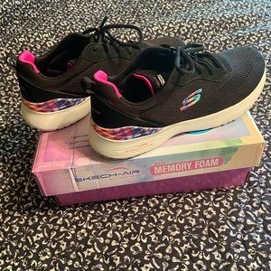 Skechers memory foam tennis shoes. Womens size 11. Gently worn 3 times.